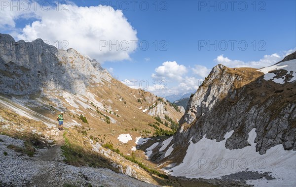 Hiker on hiking trail to the Rote Flueh