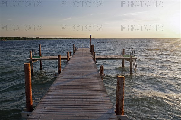 Deserted bathing jetty in the sunset