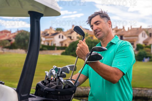 Caucasian man playing golf at golf club