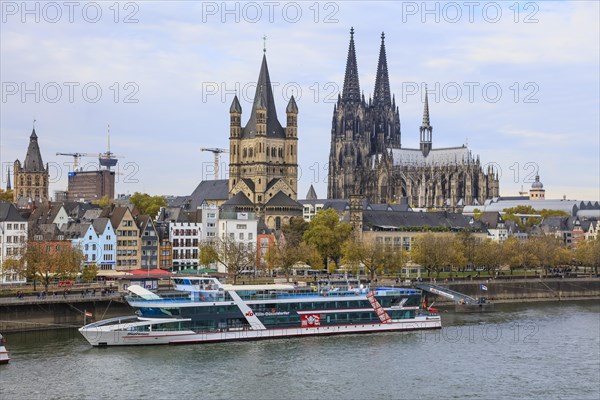 View from the Deutz Bridge across the Rhine to the banks of the Rhine at Leystapel with the excursion boat RheinFantasie of the KD Koeln Duesseldorfer