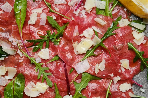 Marbled beef carpaccio with arugula and chard leaves