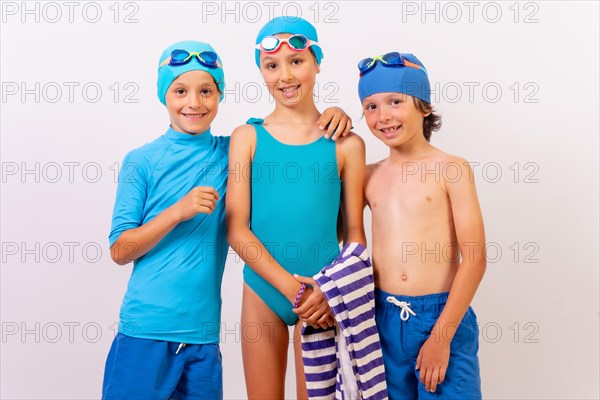 Portrait of children dressed in swimsuits for swimming lessons in the pool. White background