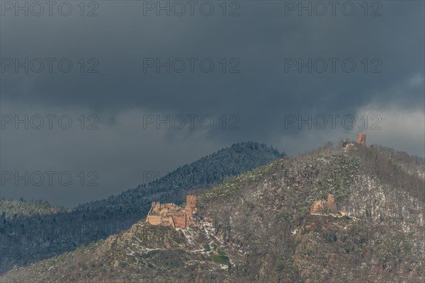 The three castles under the snow near the wine route in winter. Ribeauville