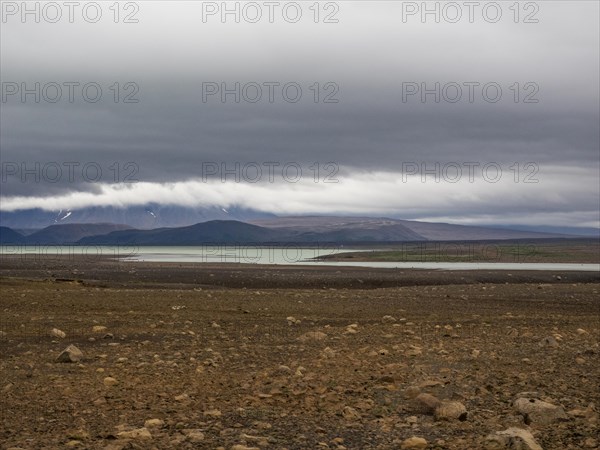 Glacial lake and barren volcanic landscape