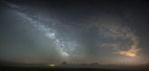 Church of St. Alban with village of Goerwangs and Milky Way with starry sky