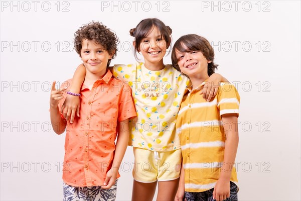 Caucasian kids hugging smiling