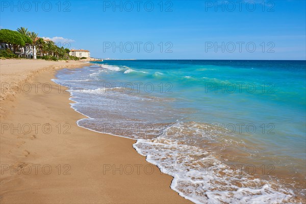 Breaking waves on a sandy beach