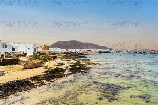 Beach and white architecture in Caleta del Sebo