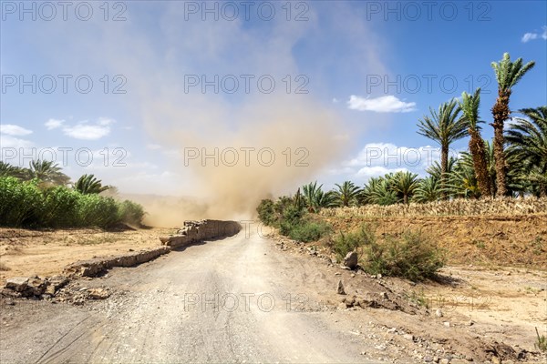 Cloud tornado on the edge of a roadway in southern Morocco. Agdz