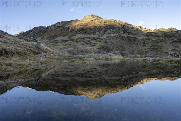 Reflection and view of the mountains at the Bernina Pass
