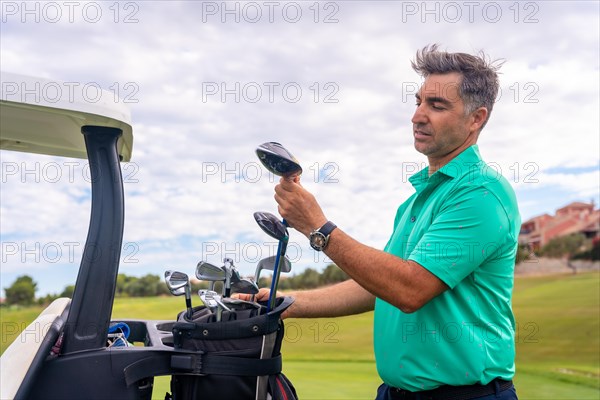 Caucasian man playing golf at golf club