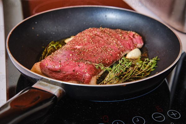 Frying duck breast in a frying pan