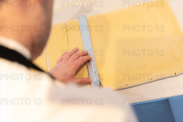 Detail of a man's hands baking homemade croissants