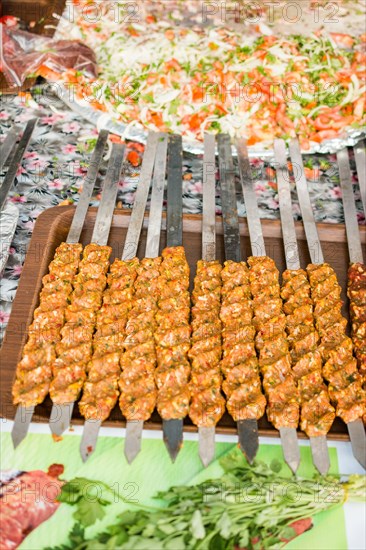 Turkish Adana/Urfa Kebab getting ready to be grilled in display