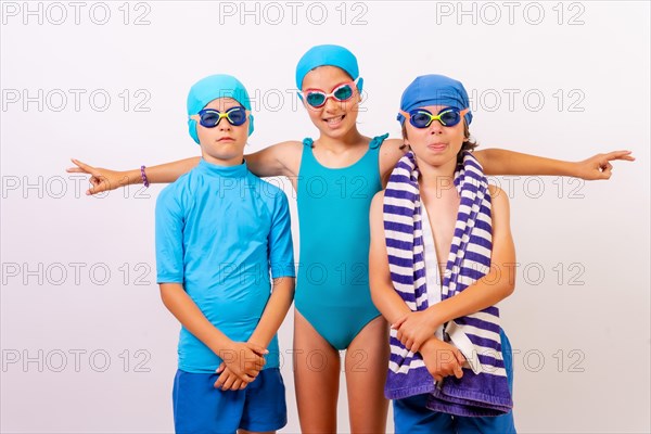 Portrait of brothers dressed in swimsuits for swimming lessons in the pool. White background