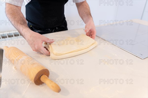 Man baking homemade croissants