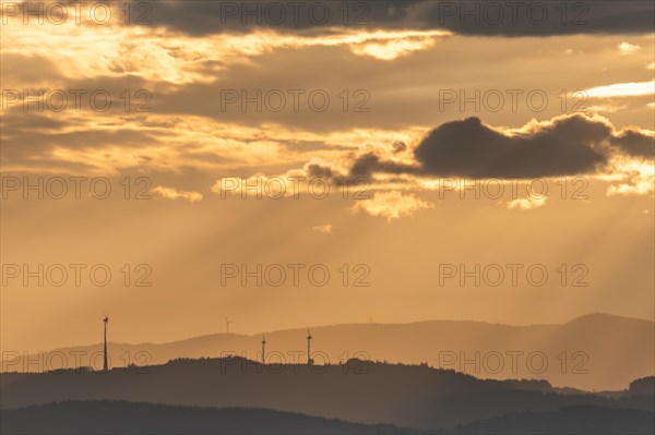 Wind turbines on the mountains of the Black Forest at dawn. Freiburg brisgau