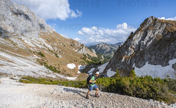 Hiker on hiking trail to the Rote Flueh