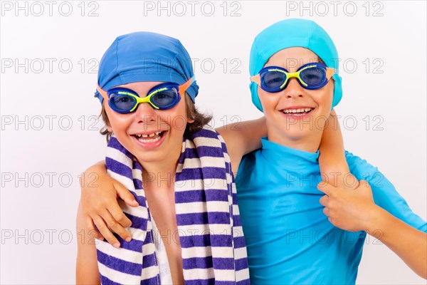 Brothers dressed in swimsuits for swimming lessons in the pool. White background