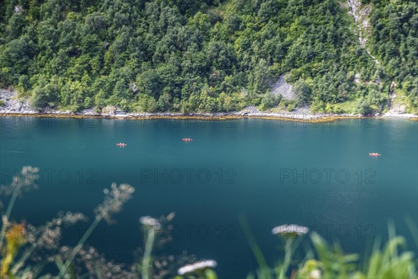 Kayakers paddling on a fjord in Norway