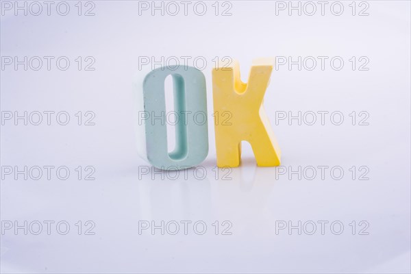 The word OK written with colorful letter blocks