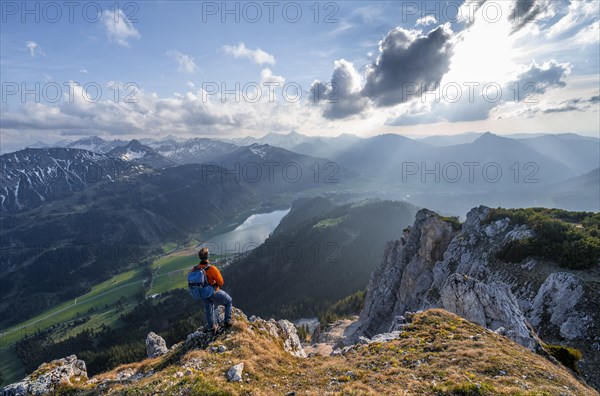 Hiker at the summit of Schartschrofen at sunset