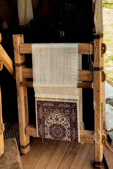 Carpet of traditional types made on a loom