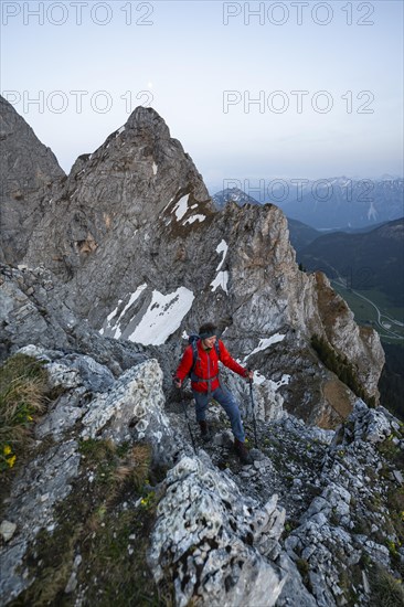 Hikers at the summit of Schartschrofen at sunset