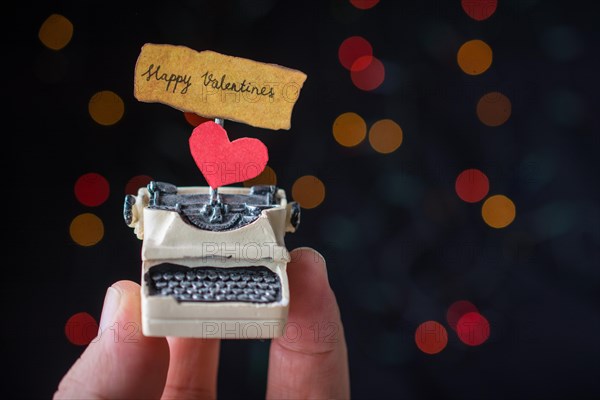 Valentine's day wording on torn typewriter as Love concept