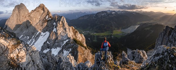 Hikers at the summit of Schartschrofen at sunset