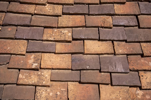 Tiled roof made of handmade tiles as texture or background