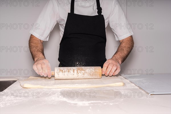 Man baking homemade croissants