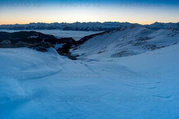 Winter landscape in front of sunrise on the Rickhubel