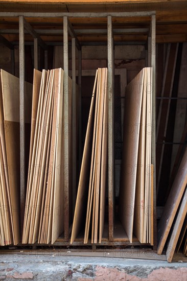 Large rectanguler wood panels stacked up together in display