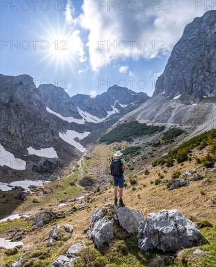 Hiker standing on a stone