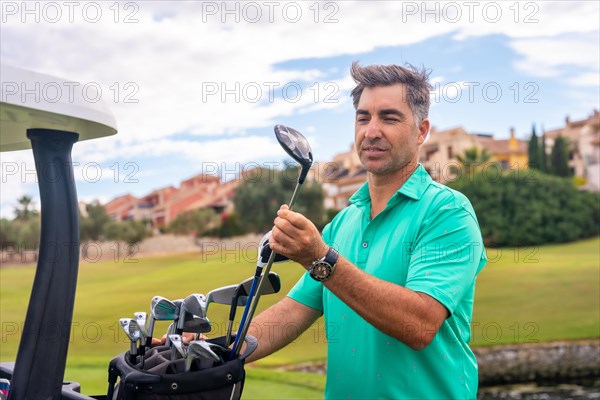 Man playing golf at golf club