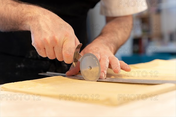 Detail of a man's hands baking homemade croissants