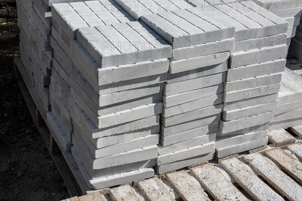 White marble slabs stacked on top of each other in display