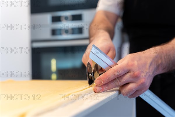 Man baking homemade croissants