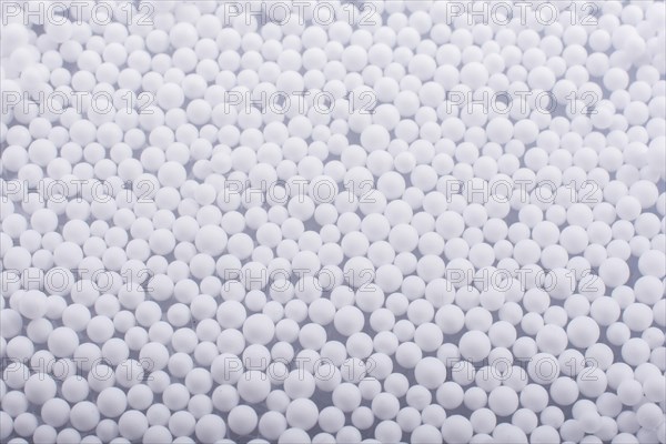 White little polystyrene foam balls as background