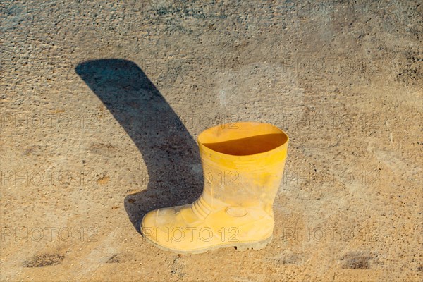 Boots on concrete texture as abstract grunge background