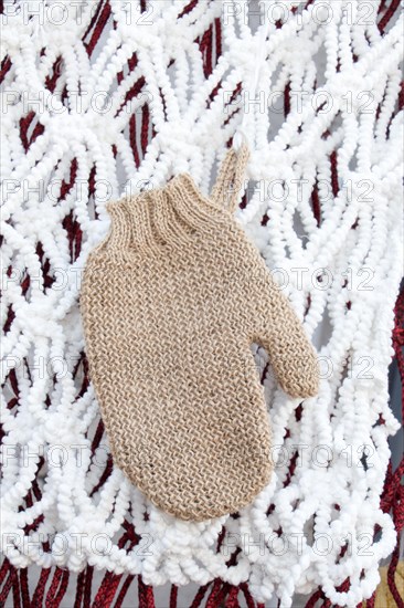 Brown mitten on a white background in the view