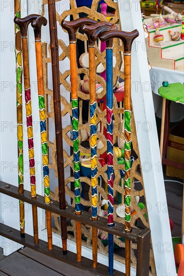 Colorful decorative wooden walking sticks in the view