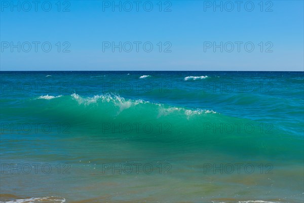 Breaking waves on a beach