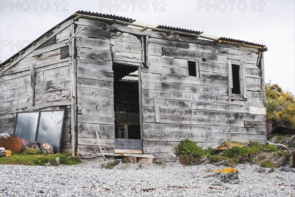 Wooden shack with sheet roof and no door in Ushuaia