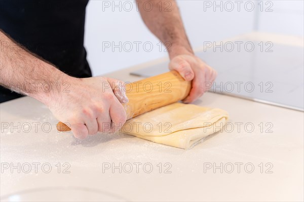 Man baking homemade croissants