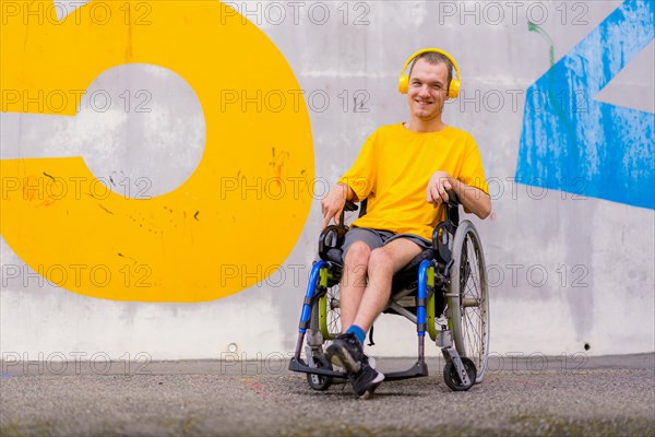 Disabled person in wheelchair listening to music