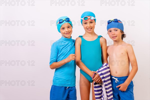 Portrait of children dressed in swimsuits for swimming lessons in the pool. White background