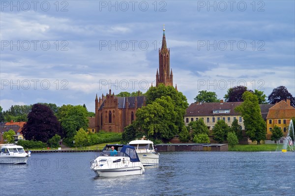 Mecklenburg-Western Pomerania Mecklenburg Lake District The Malchow Monastery Sport boats on Lake Malchow