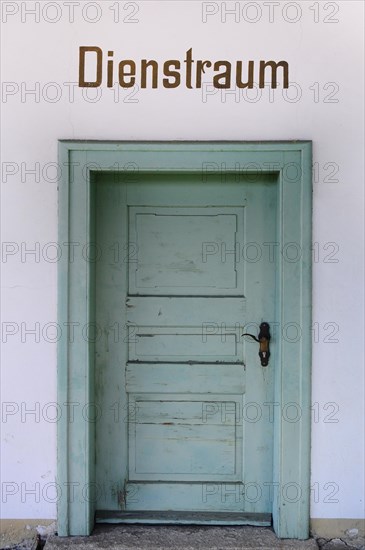 Door to the waiting room of an old station building